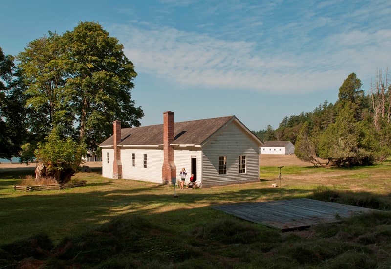 English Camp Barracks people visiting a historic building
