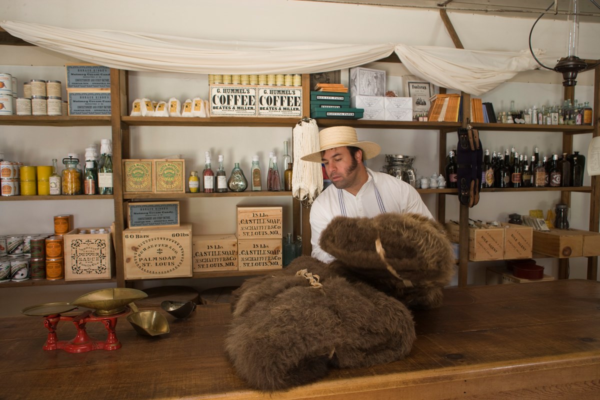 Living history interpreter portraying the Post Trader.