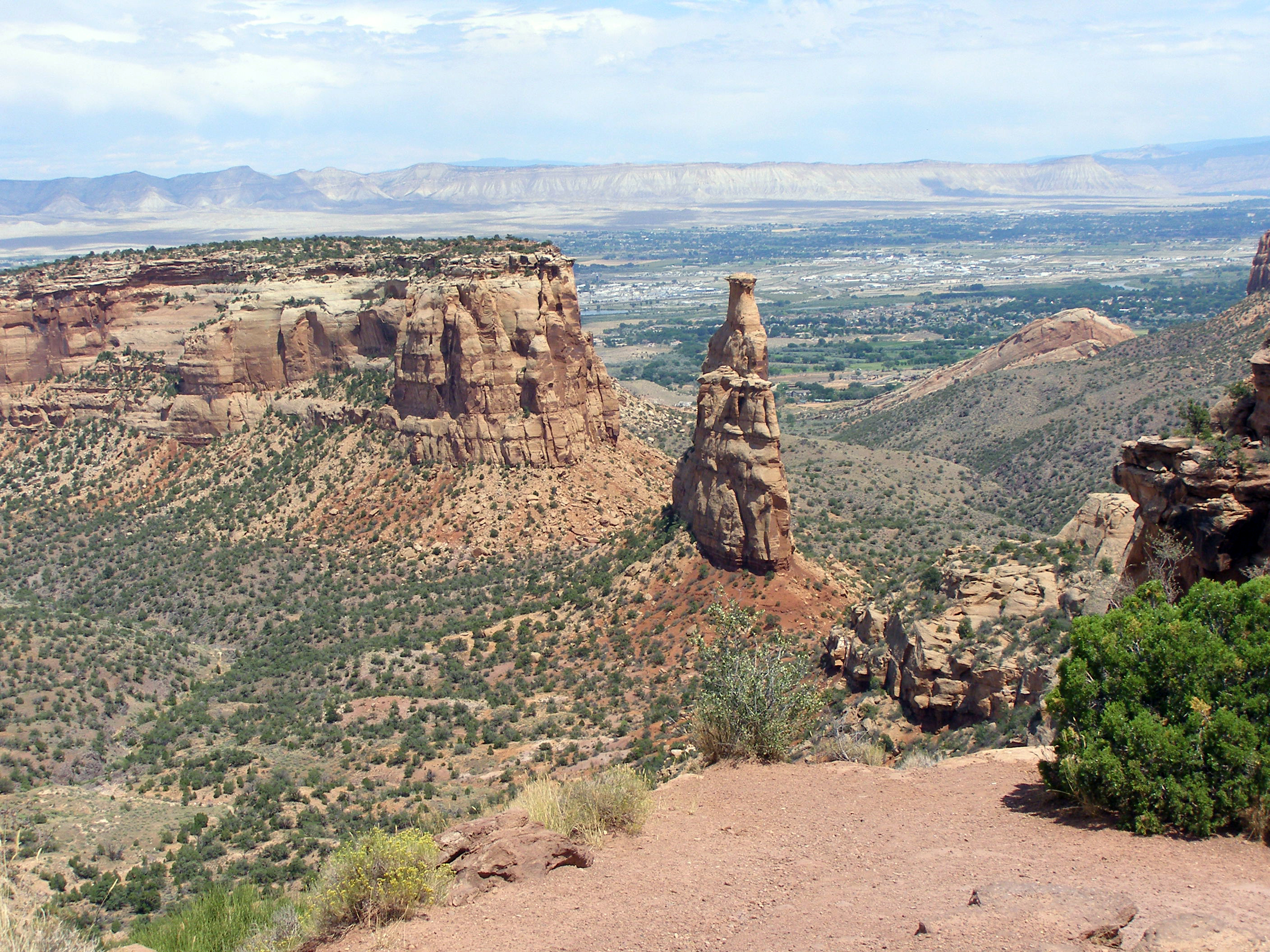 View of Independence Monument with Grand Valley in background. Taken from Rim Rock Rock Drive.