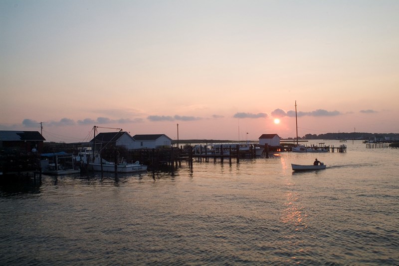 Tangier Island At sunset, a boater returns to the docks used by working watermen at Tangier Island.