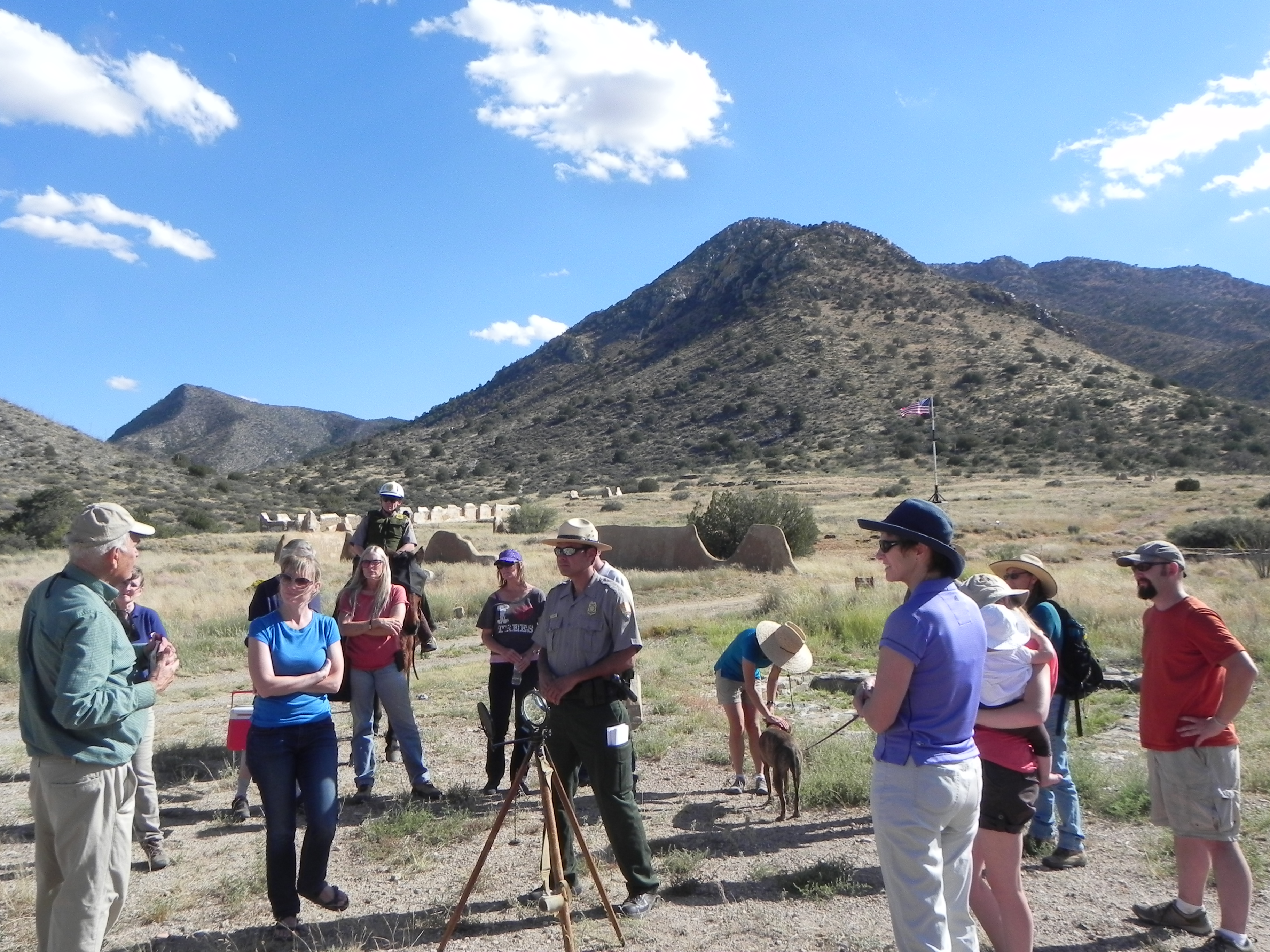 A group gathers as a ranger displays the heliograph equipment