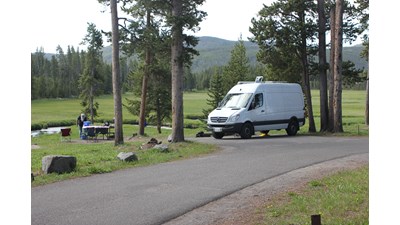 Small RV parked at a campground