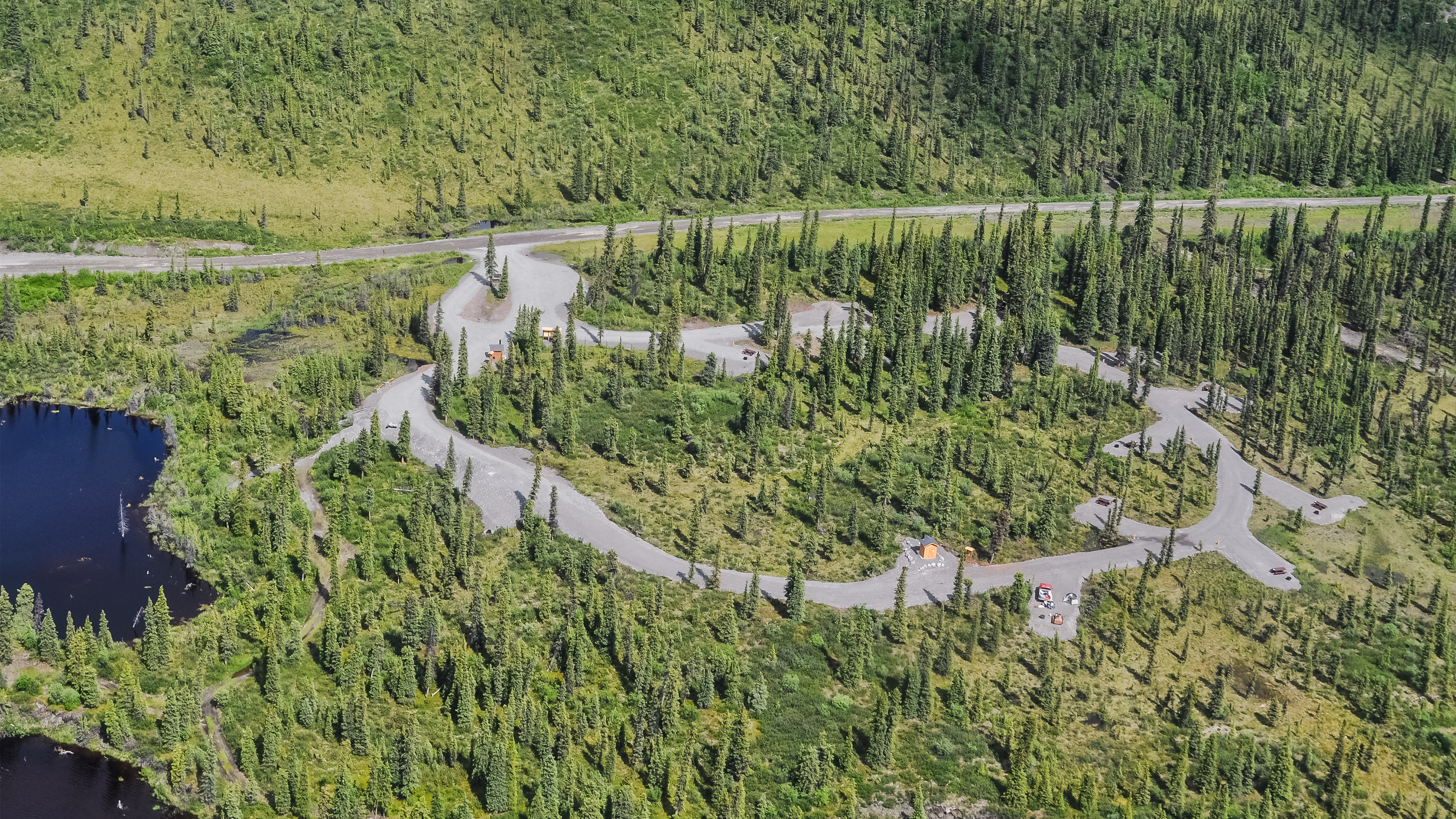 Aerial view of a campground surrounded by Boreal Forest.