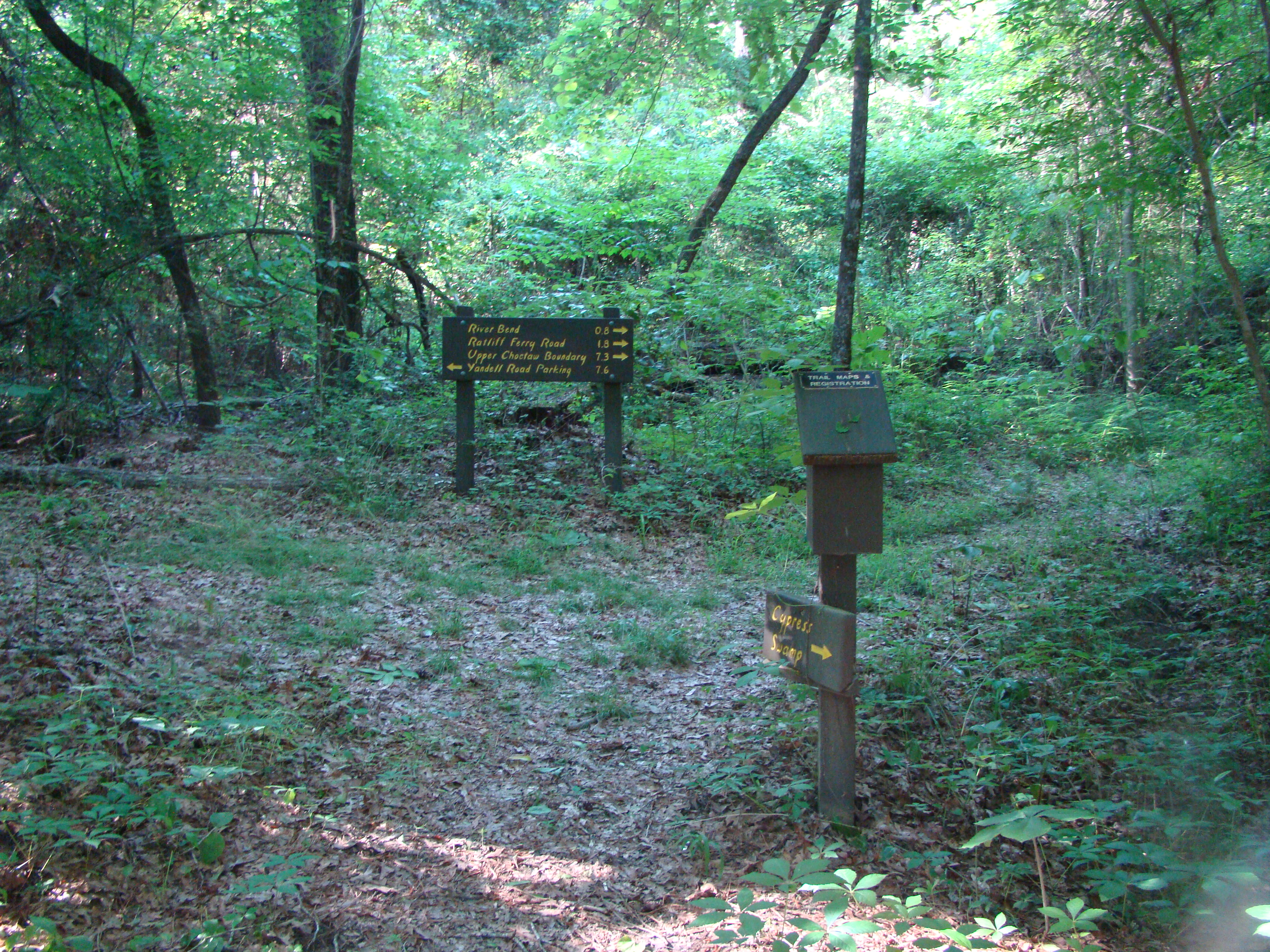 A fork in the trail with directional signs