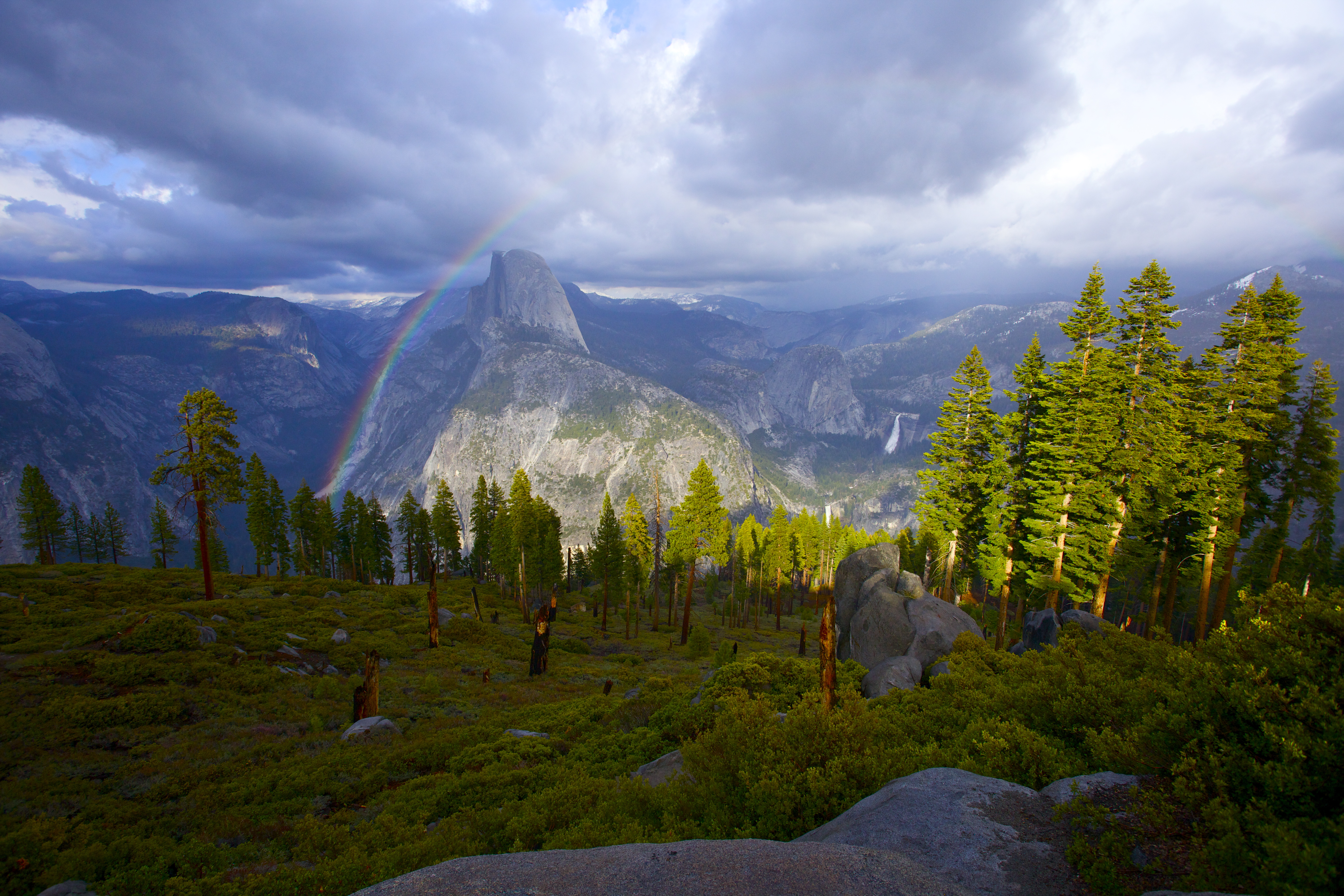 A rainbow over a mountain in the distance.