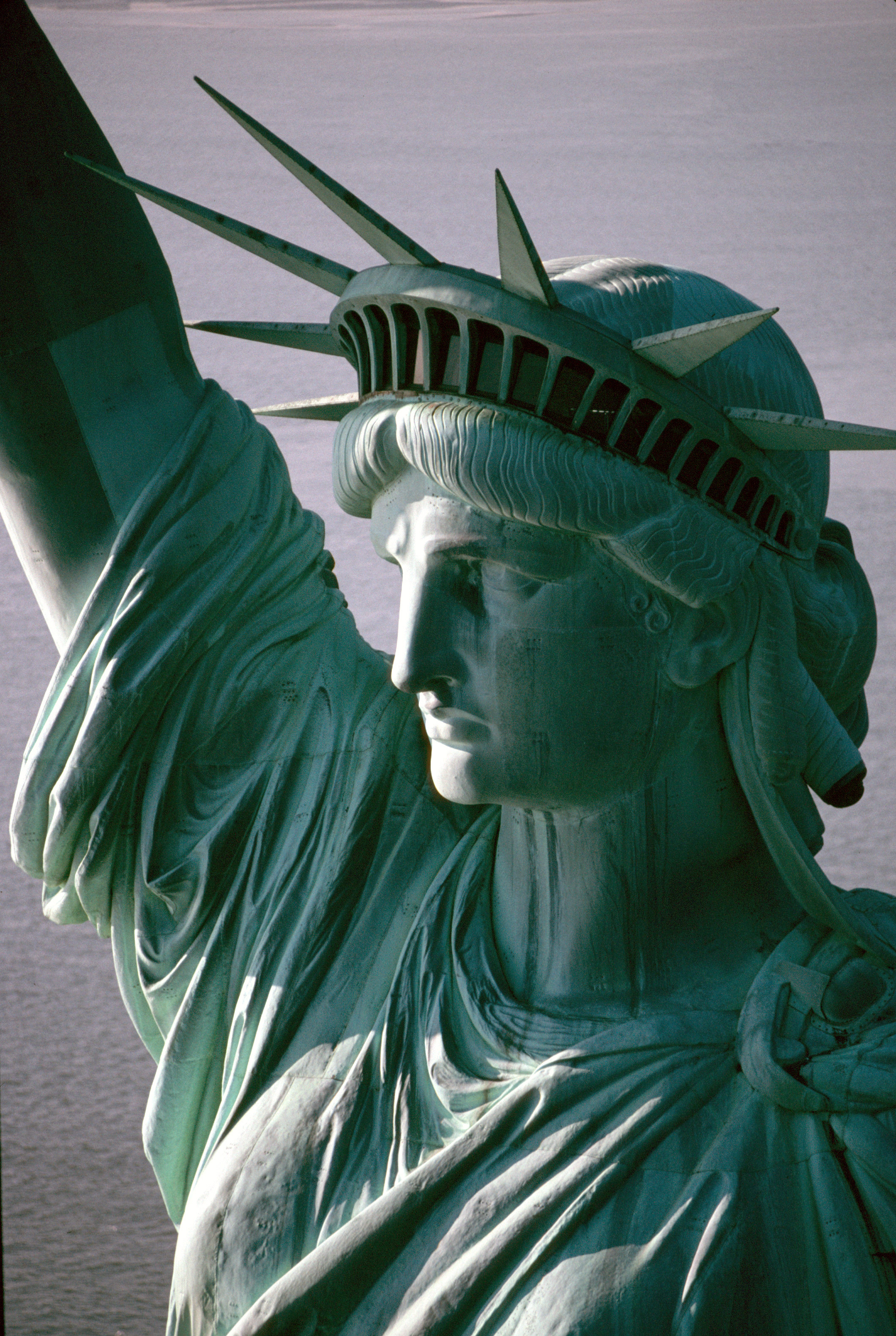 Close-up of the Statue of Liberty's head, crown, and the folds of her robe