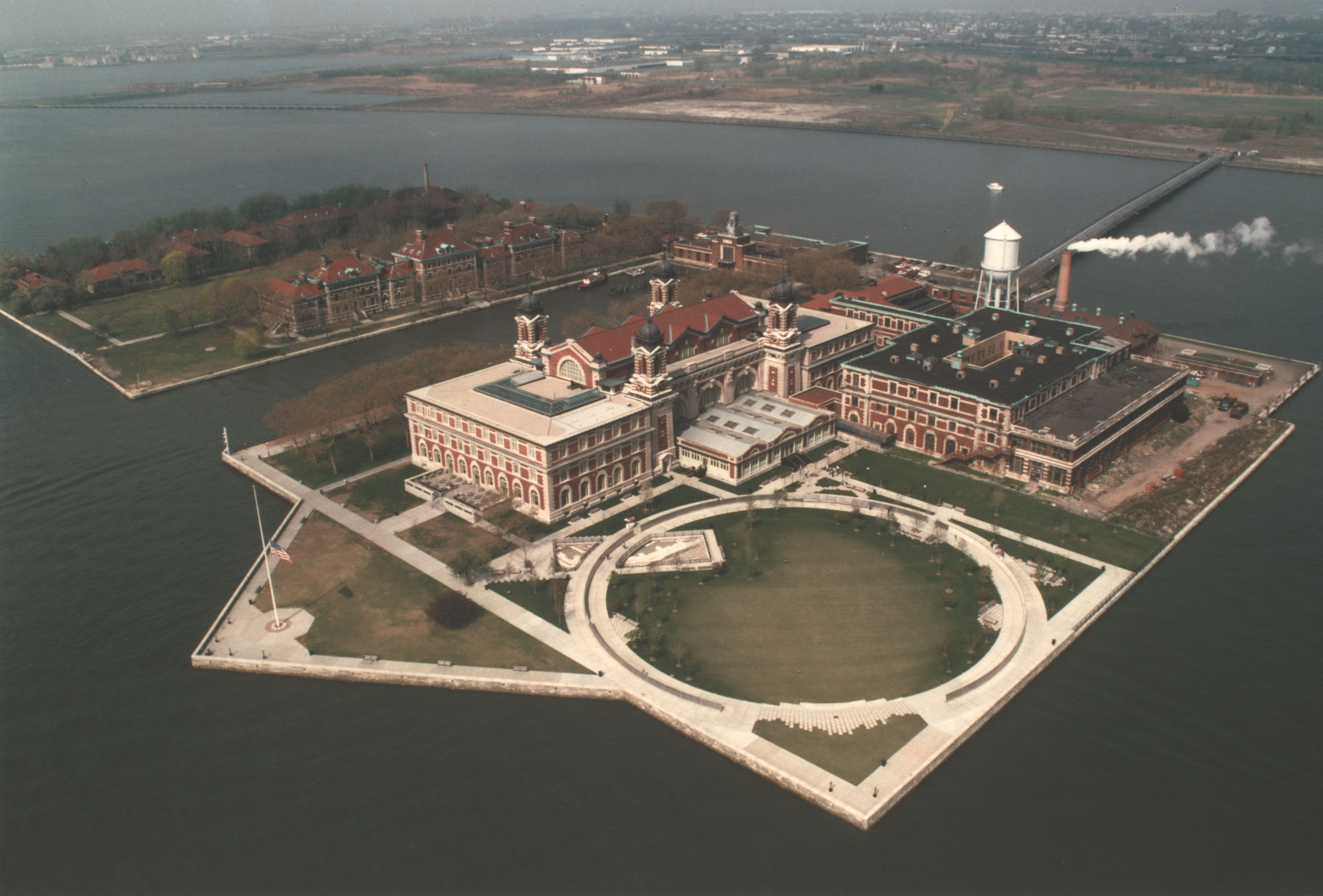 Artificially-expanded largely rectangular island with straight seawalls and large buildings.