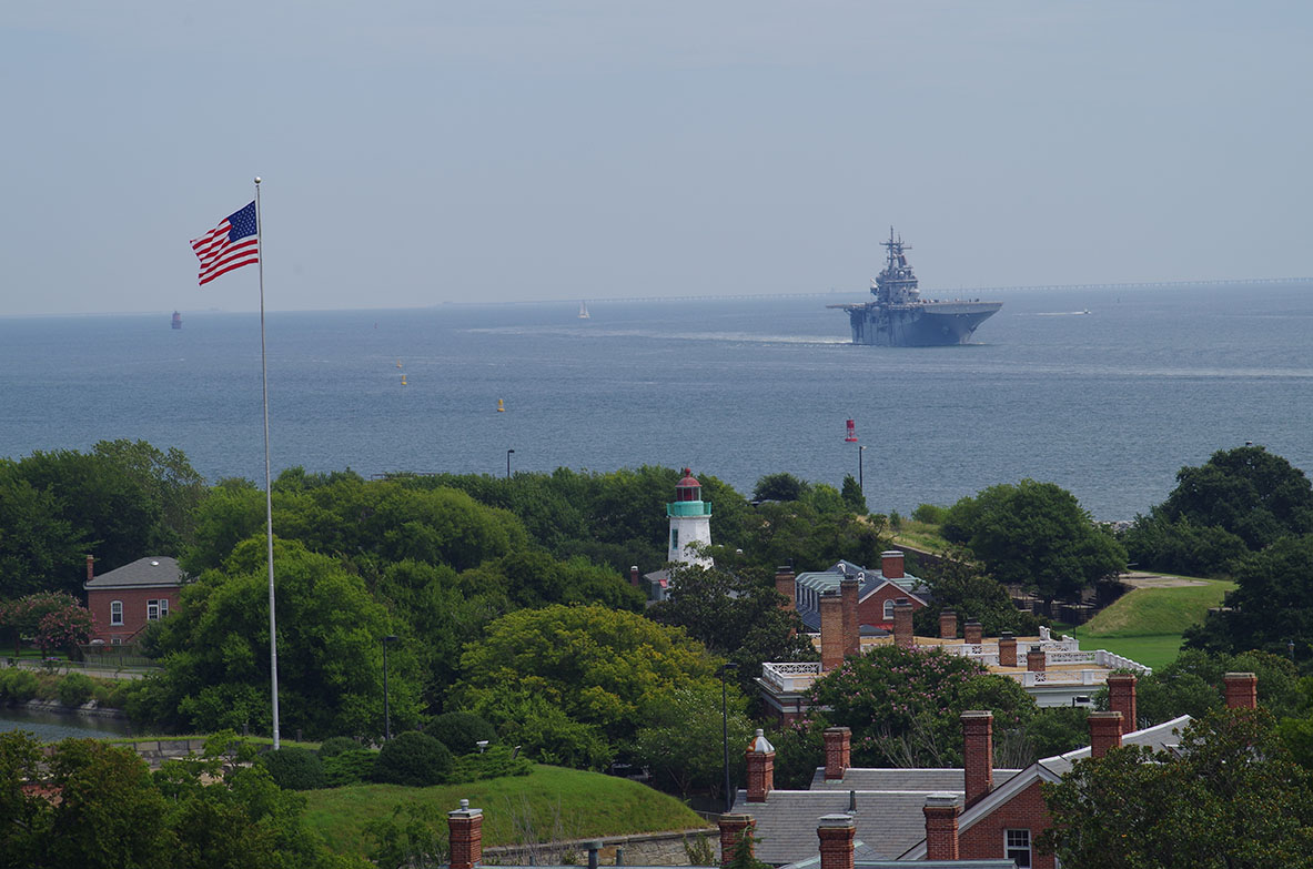 Fort Monroe in foreground with USS Kearsarge in background.
