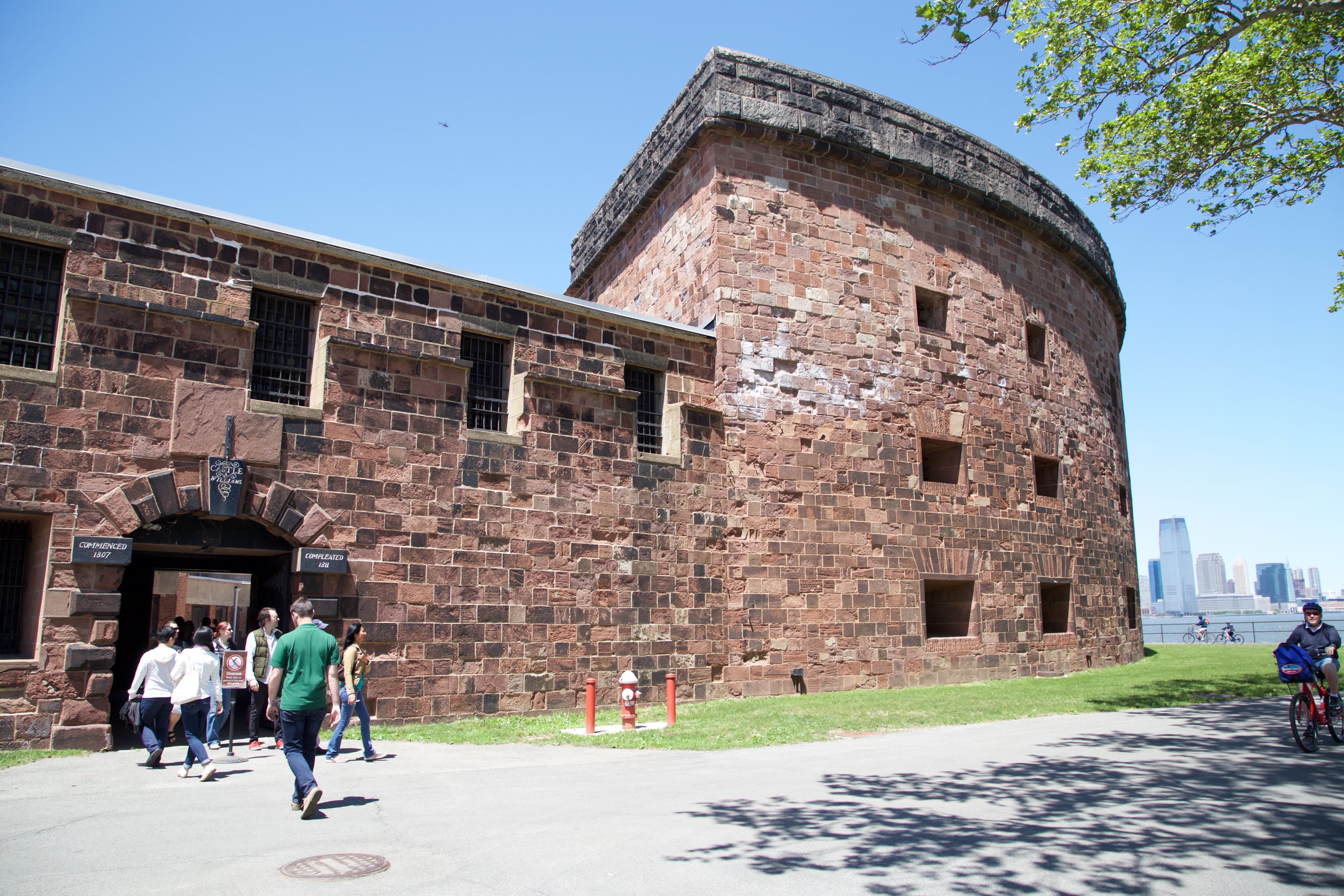 Front of sandstone brick fort with arched entrance way.