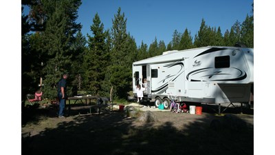 RV and people at a campsite