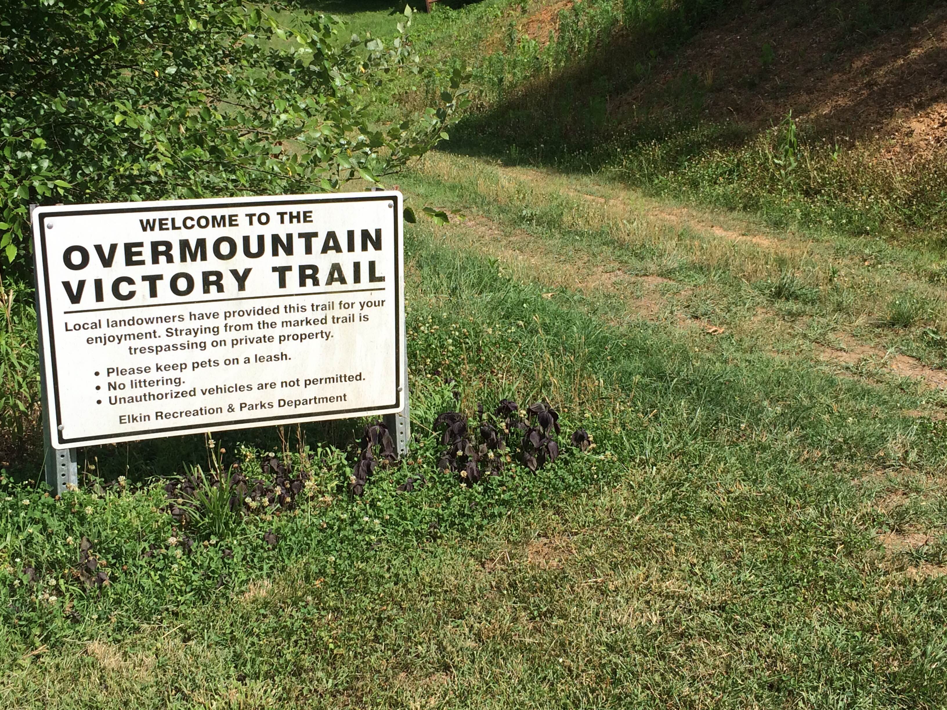 A sign on the Overmountain Victory Trail at Elkin reminds visitors not to stray off the trail.