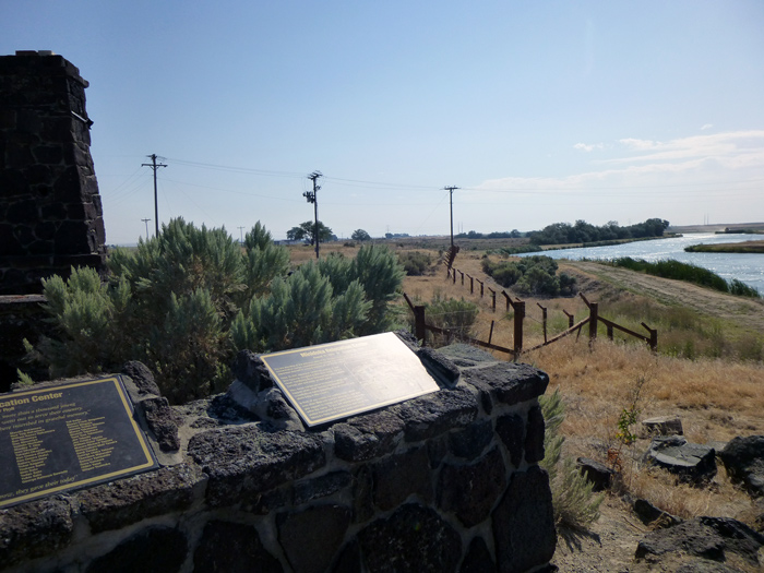 A view of the Northside Canal and reconstructed barbed wire fence.