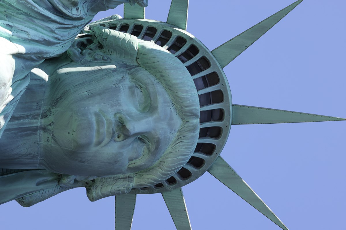 A close-up of the Statue of Liberty's face and crown.
