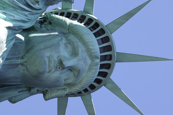 A close-up of the Statue of Liberty's face and crown.