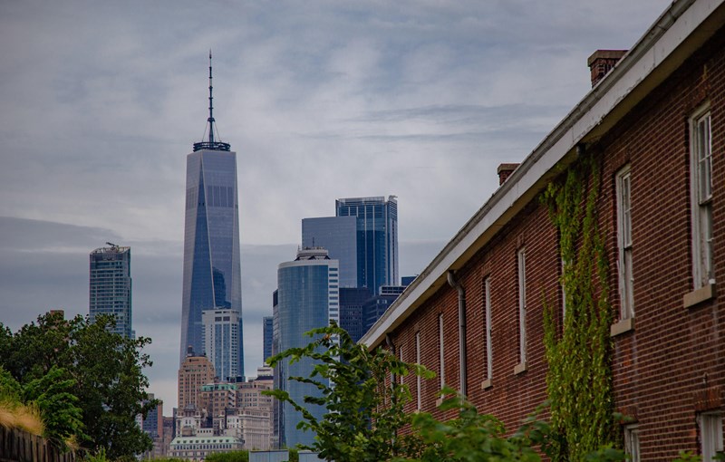 Manhattan from Fort Jay Manhattan Skyline stands behind the barracks of Fort Jay