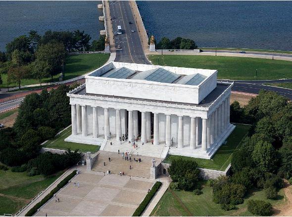 A rectangular, white colonnaded building seen from the air