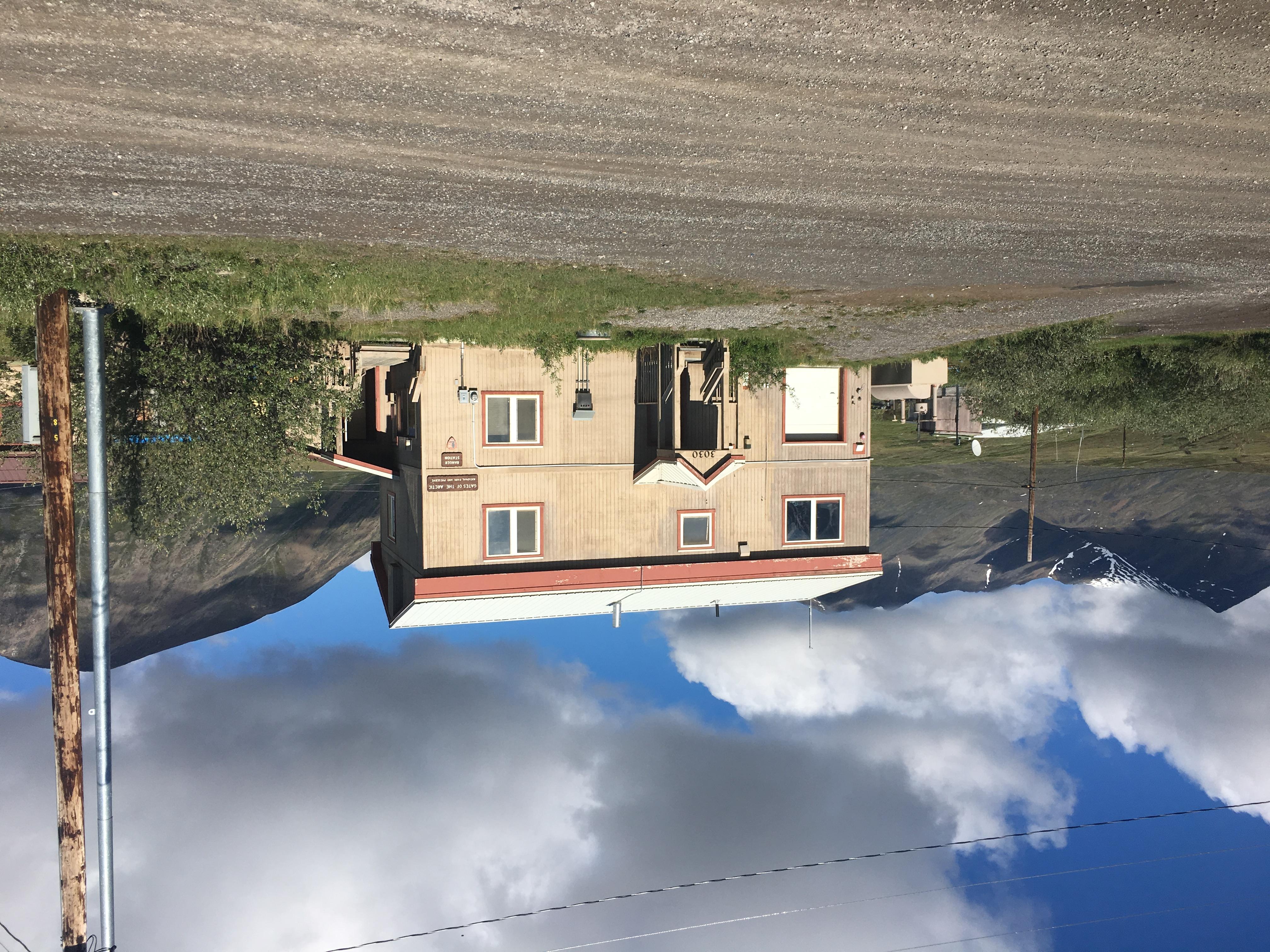 View of two story tan building