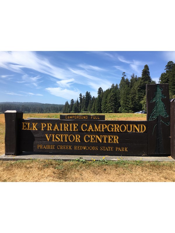 Brown and yellow park sign.