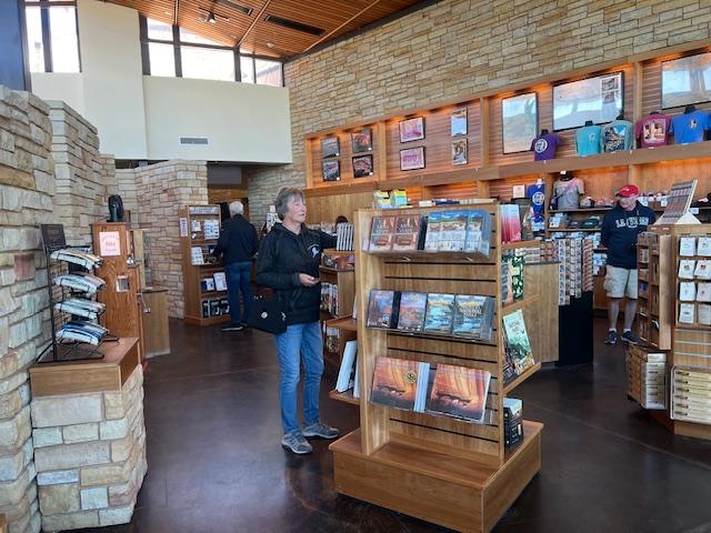 Visitor shops in the park store.