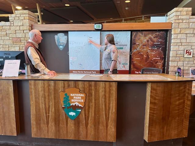 Rangers answer questions at the visitor center desk