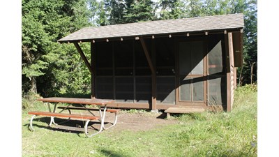 Campground Shelter with picnic table.