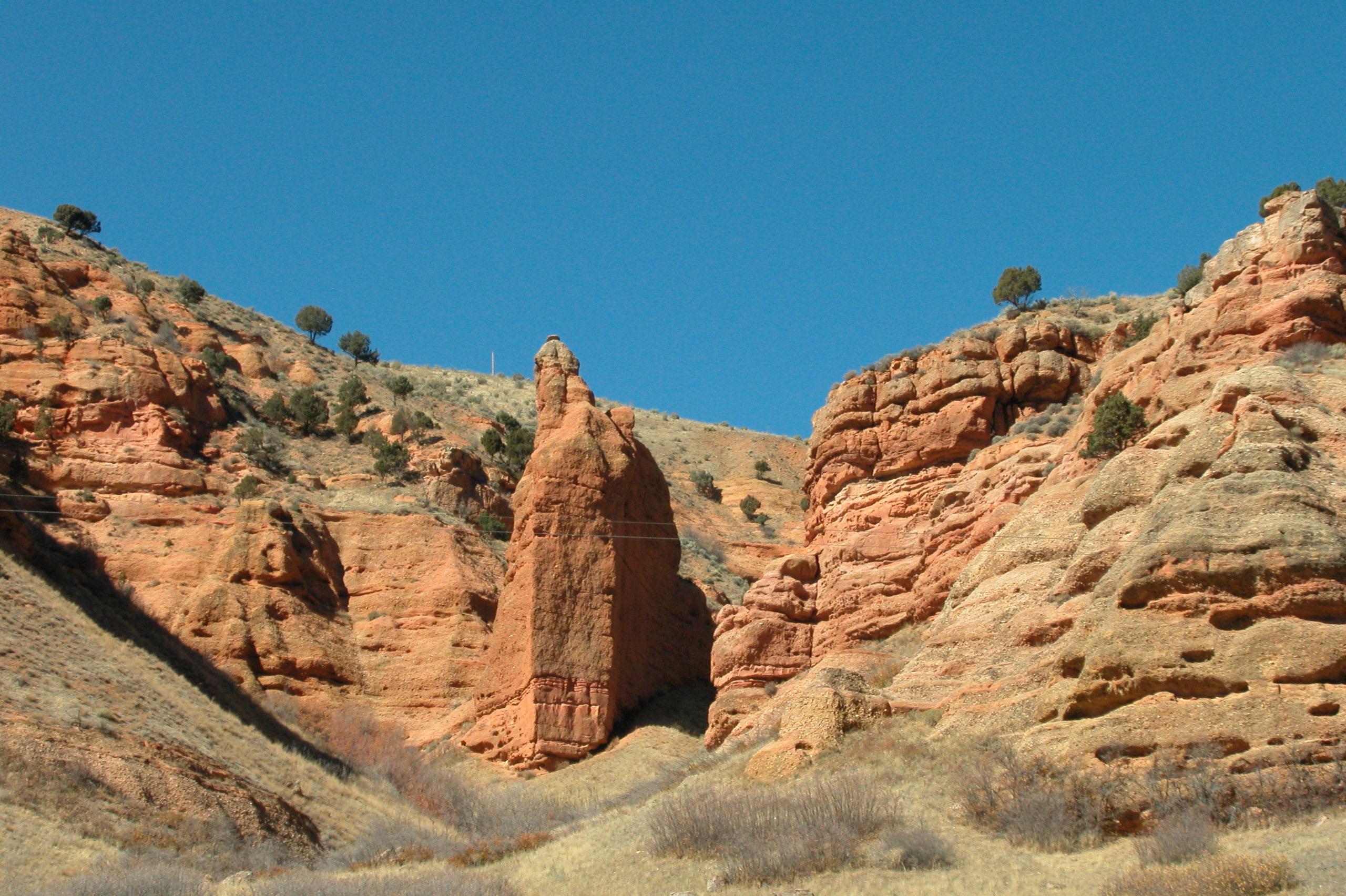 Red rock monolith in a rocky canyon