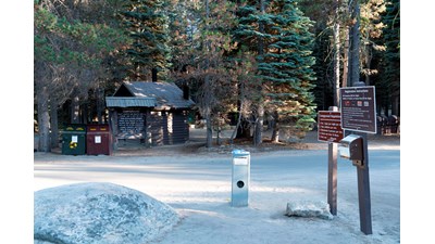 signs near the entrance of the campground about self-registration
