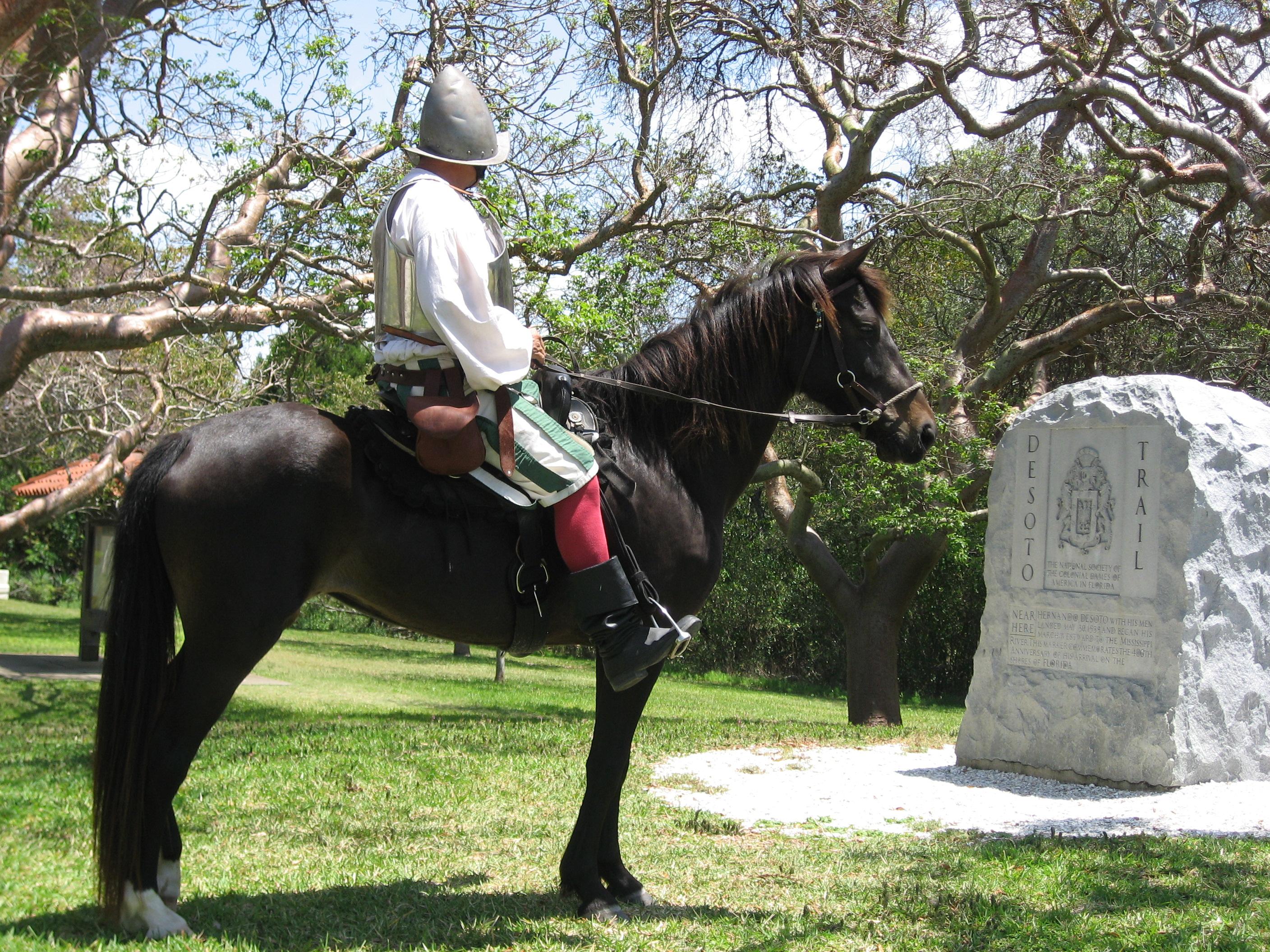 Reenactor Bill Boston on his horse Dixie in front of the De Soto Monument.