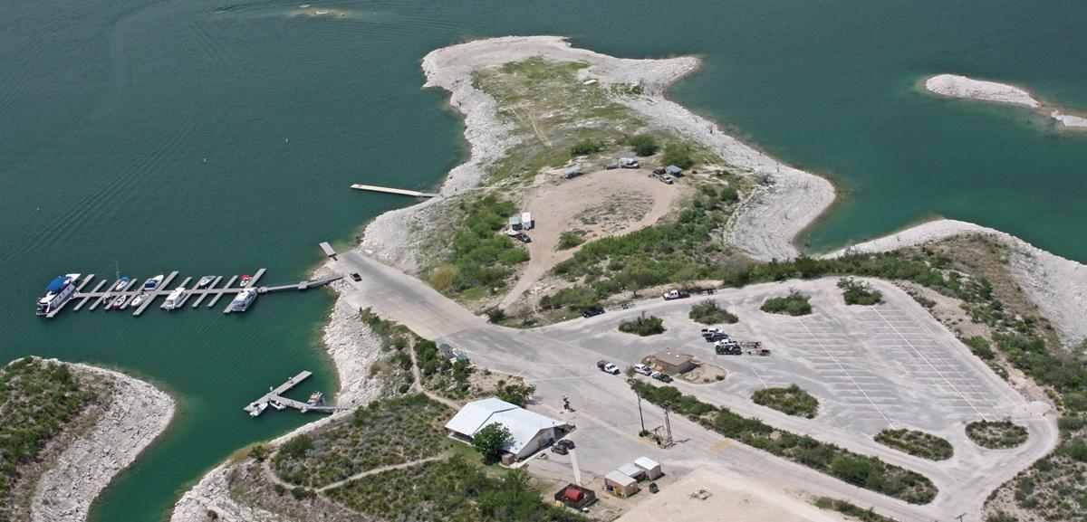 Aerial view of Rough Canyon Campground surrounded by lake on three sides.
