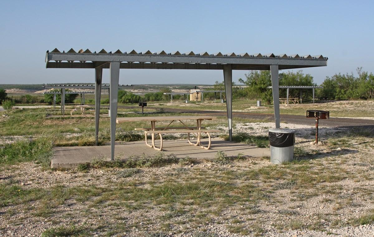 Picnic table under shade shelter.