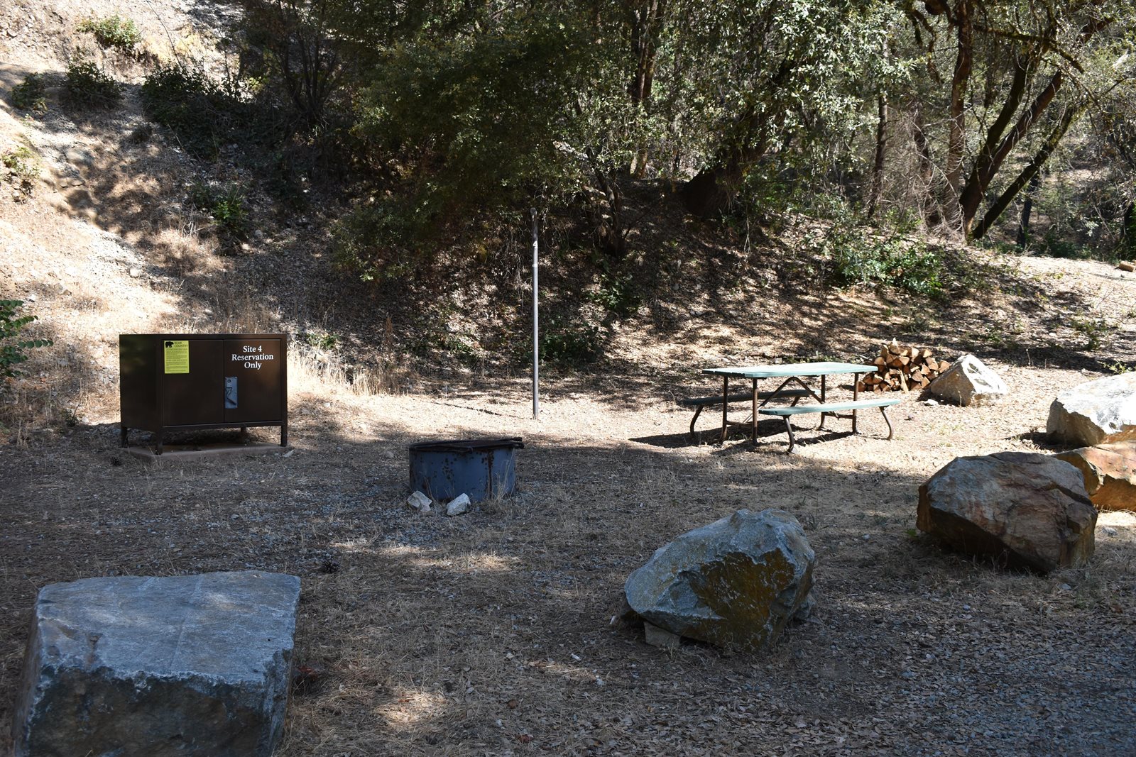 Site 4 at Peltier Bridge Campground, Whiskeytown, a drive-up tent site under heavy tree cover
