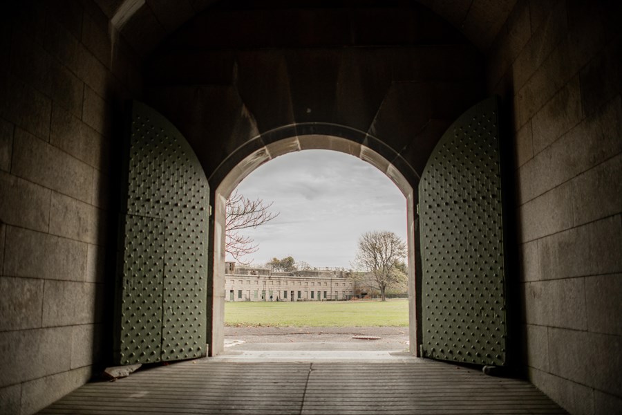 A big arched door opens to the parade ground of Fort Warren.