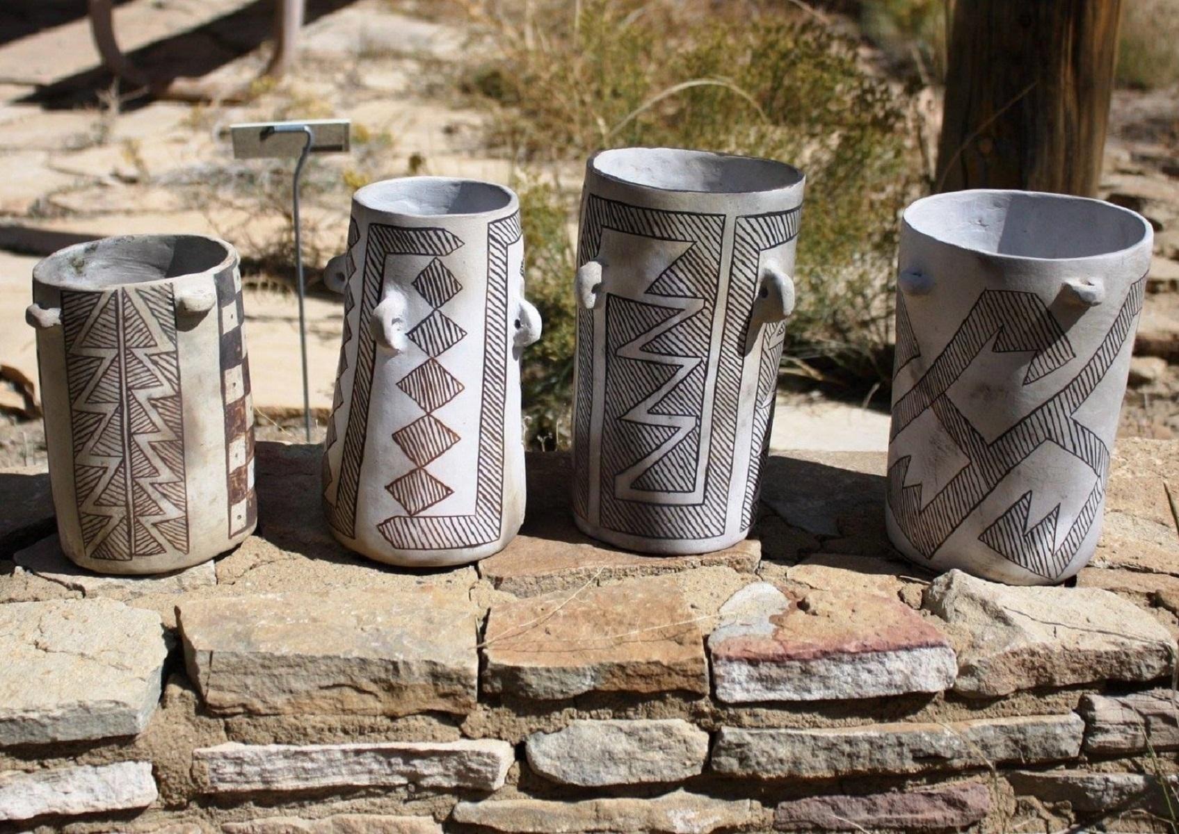 A series of 4 Chacoan jars replicated in the same black on white style that was excavated long ago.