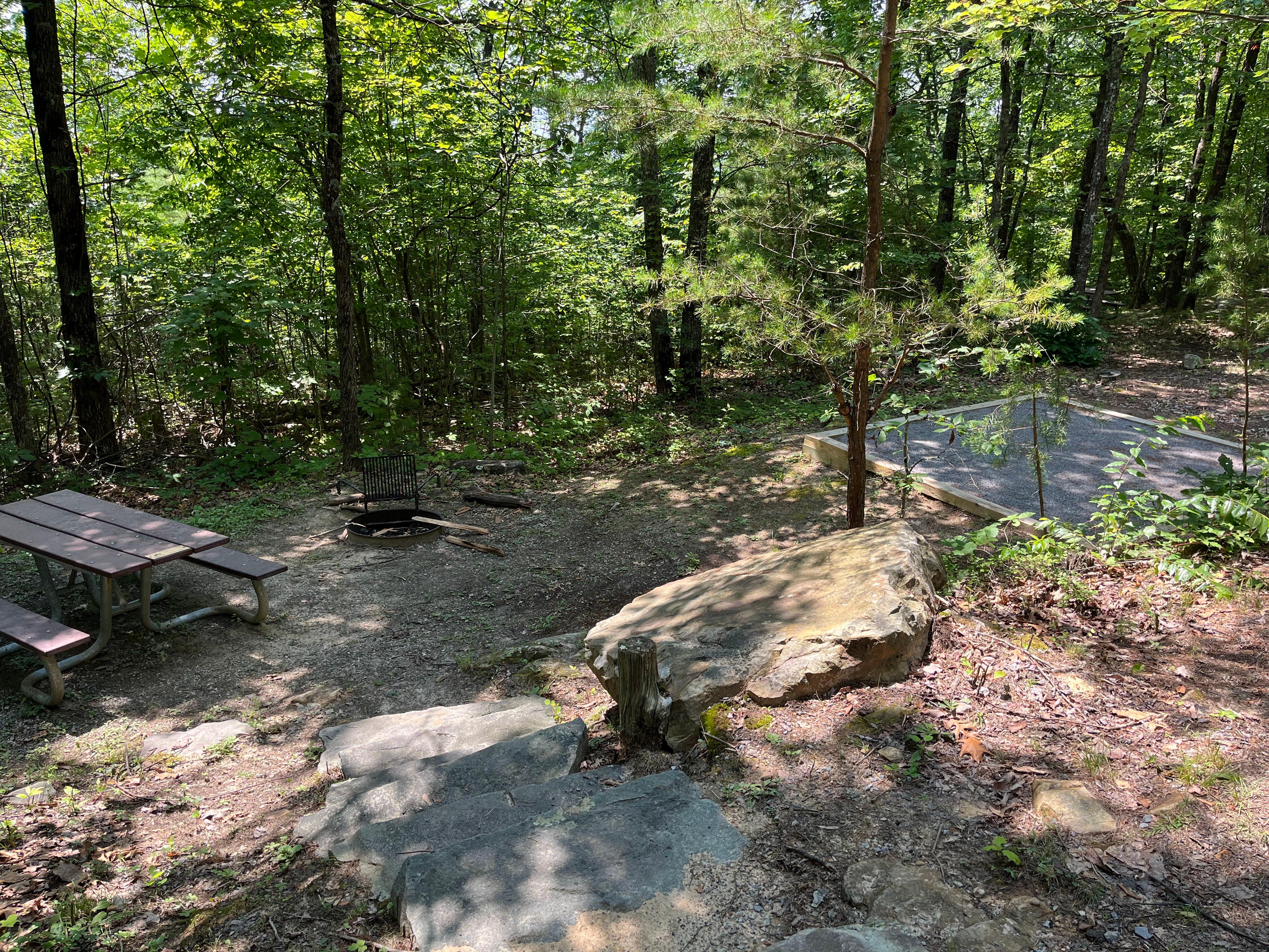Some Look Rock Campground sites are down a set of stone stairs or a slope from the parking space.