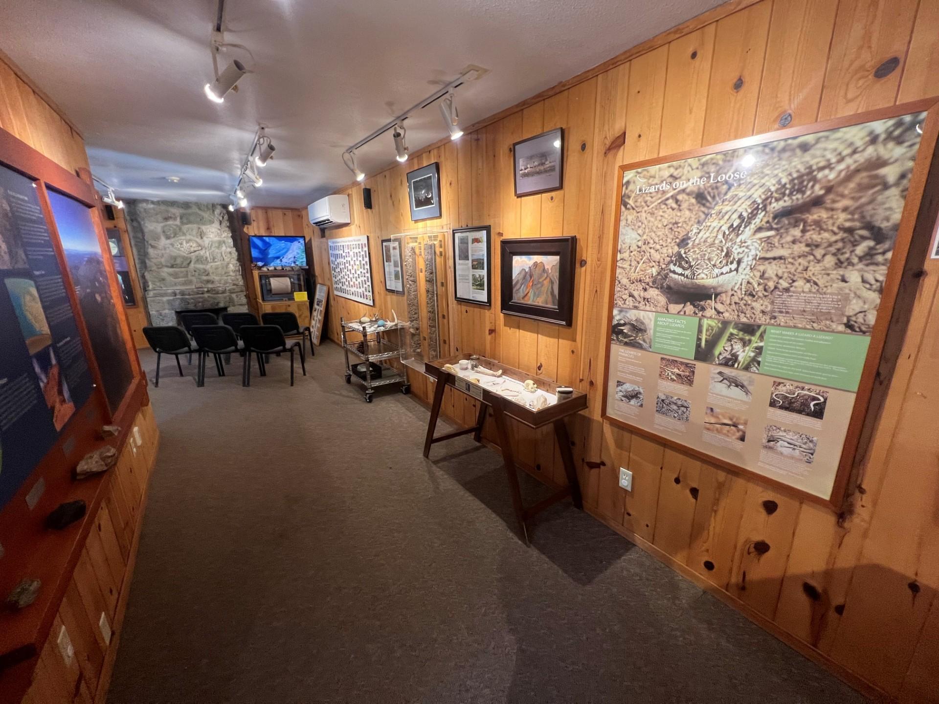 Interpretive displays and exhibits inside a wooden and stone structure