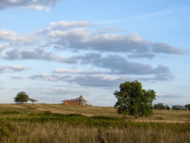 Grounds The tallgrass prairie spans to the Heritage Center on the horizon.