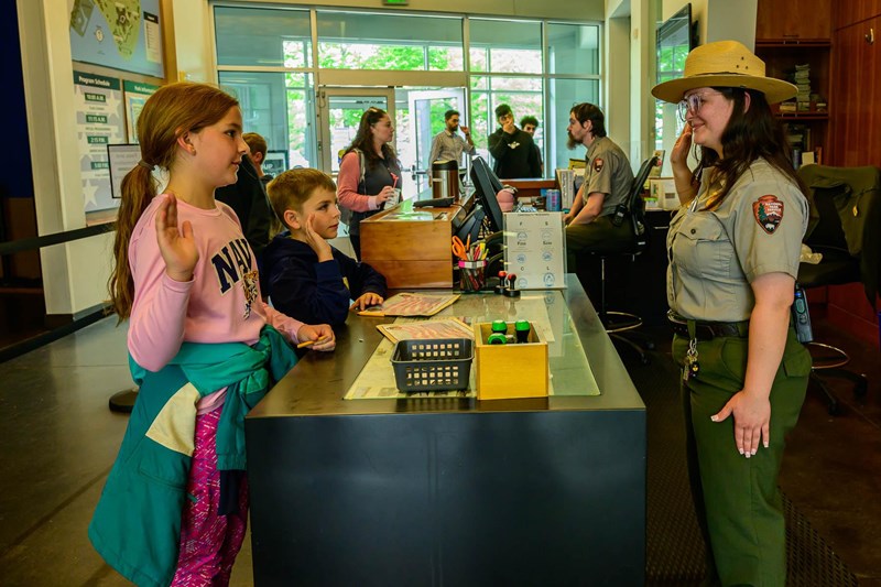 Junior Rangers at FOMC Two young visitors with their right hands in the air as they are sworn in as Junior Rangers