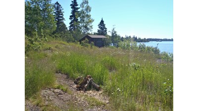 A shelter sits on the Lake Superior shoreline.