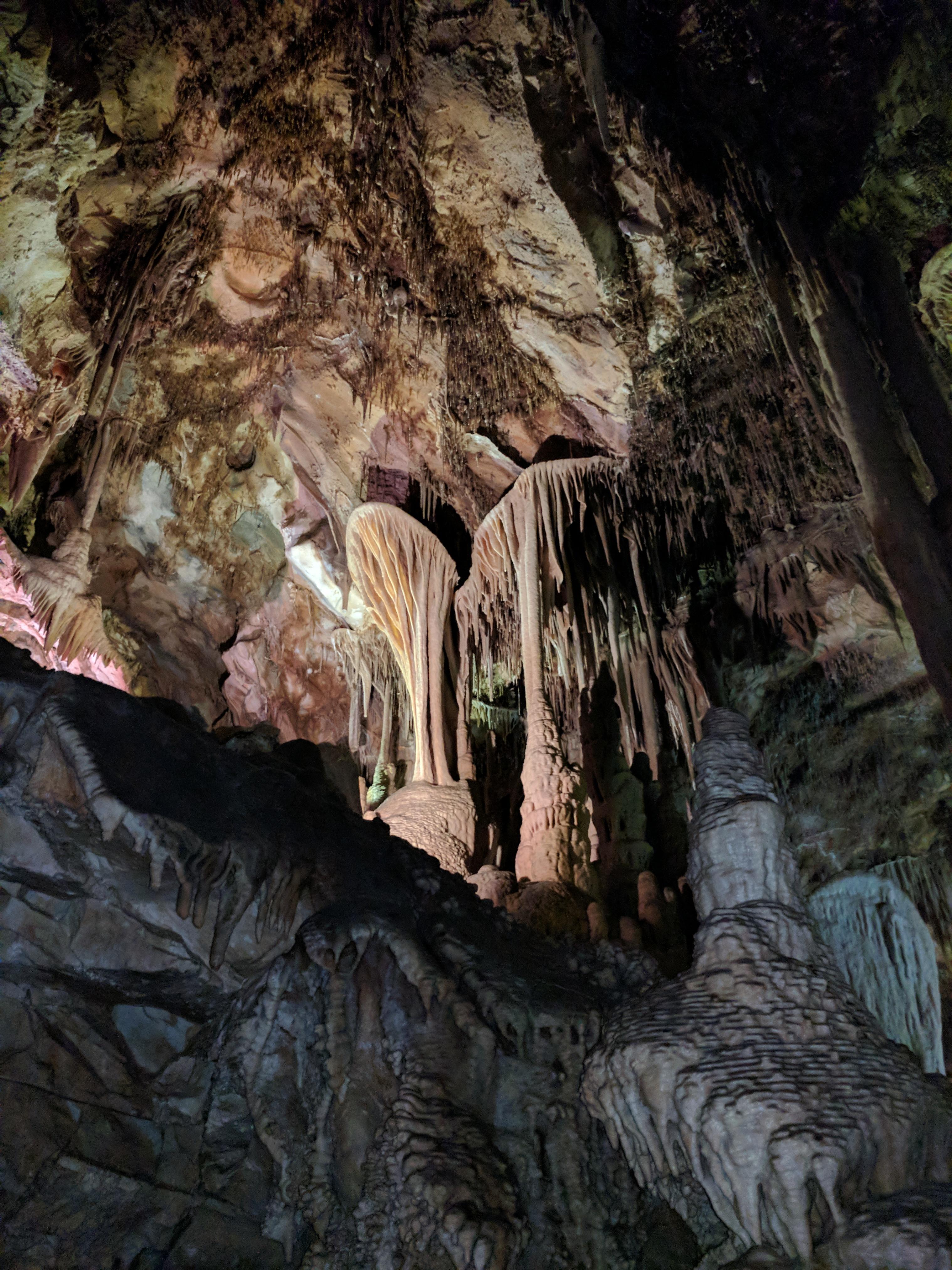 Brown and tan cave formation in the shape of a parachute