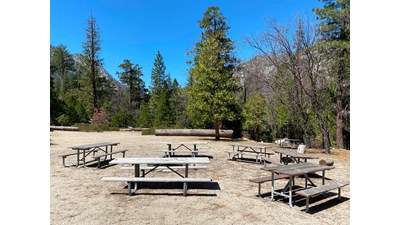 A group site at Canyon View Campground features several picnic tables in a circle.