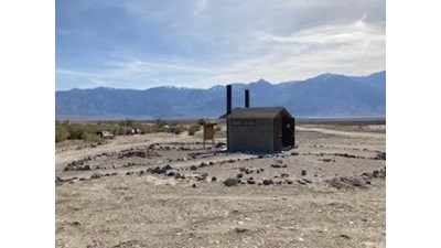 Vault Toilet with view of the mountains in the background