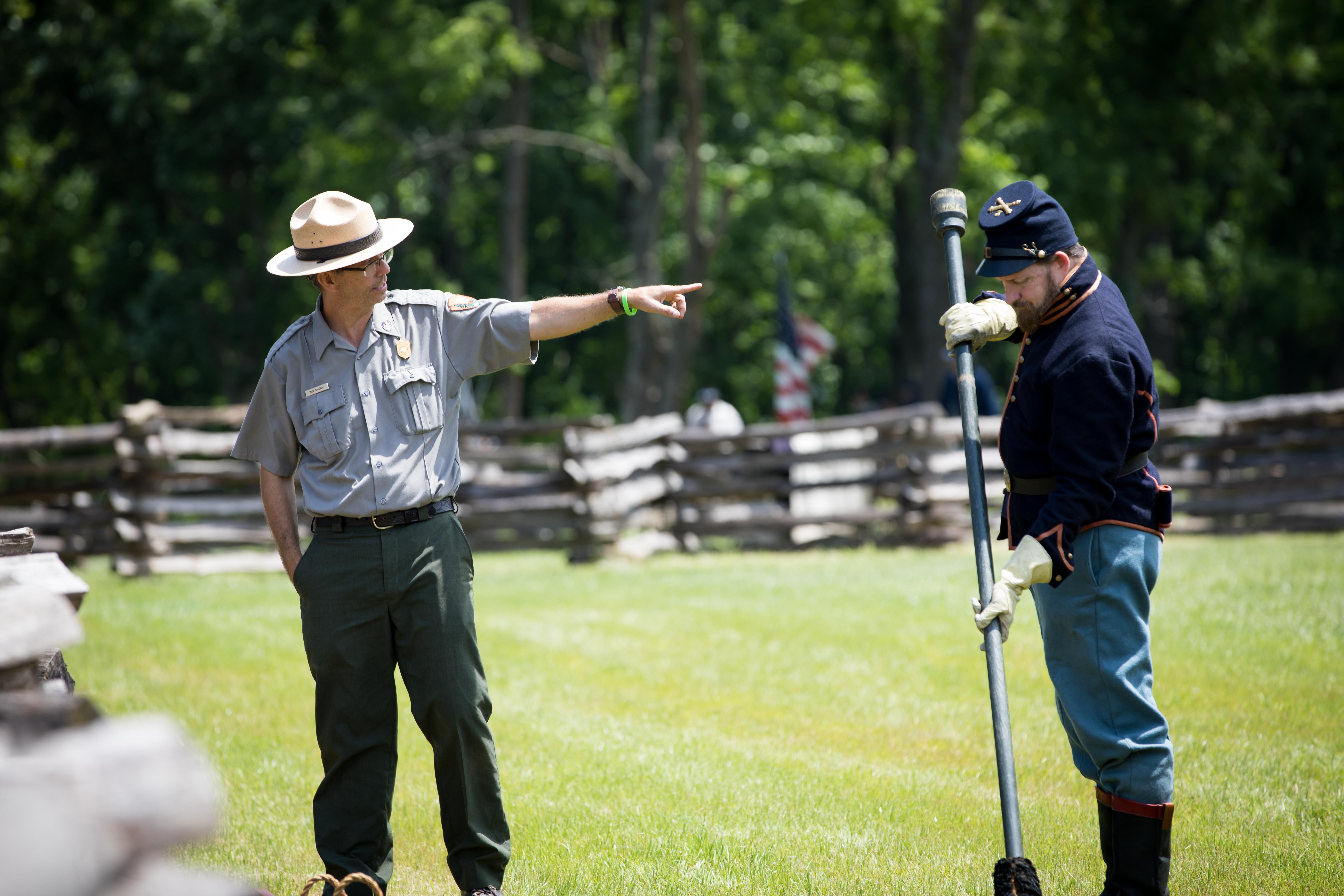 Photo of Park Ranger talking about cannon and Cannon Crew.
