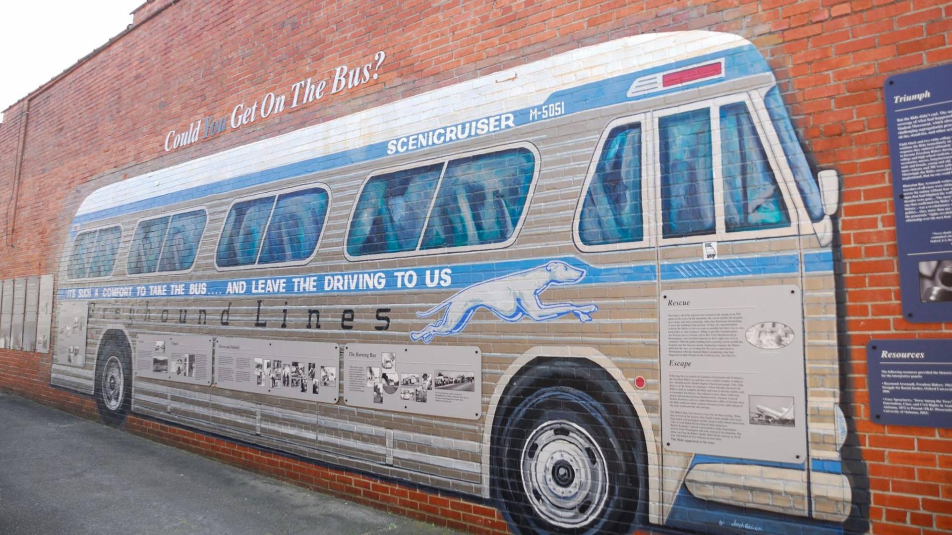 Colored Greyhound mural with historical information about the Freedom Riders