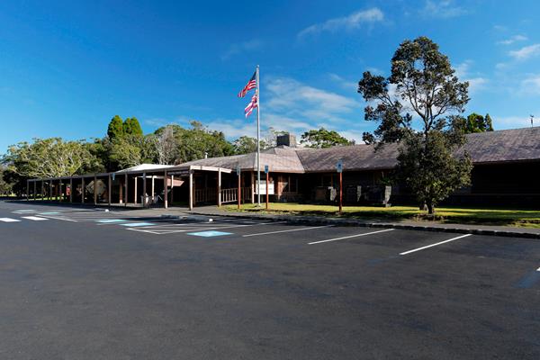 Kīlauea Visitor Center beyond an empty parking lot