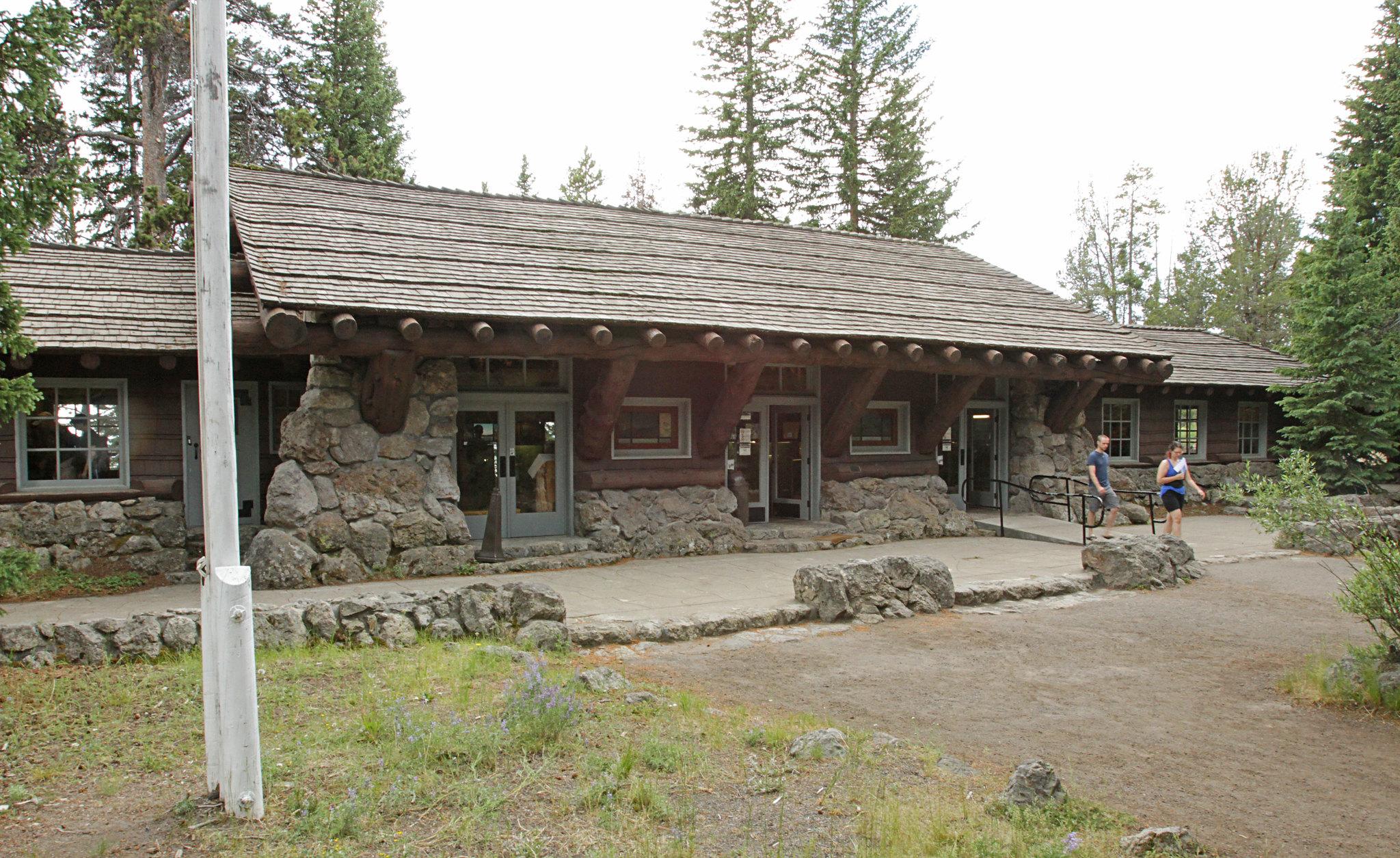 The front of the log structure that houses the Fishing Bridge Visitor Center.