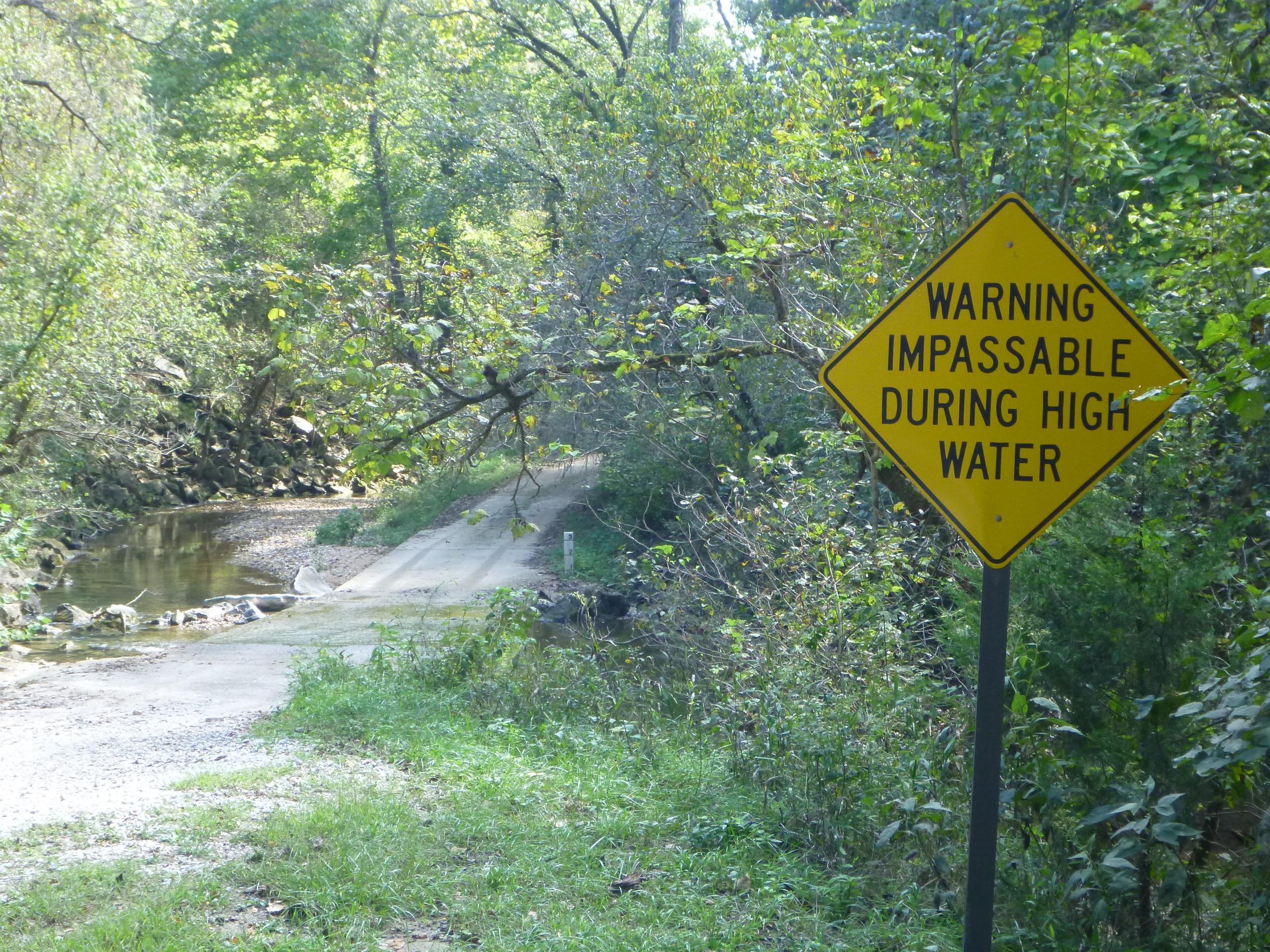 A sign warning visitors that Rush Creek can be impassable during high water.