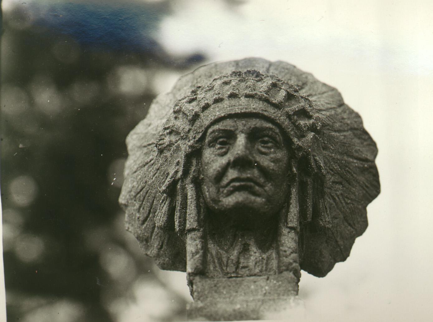 Stone carving of a Nez Perce Warrior's head in full regalia.