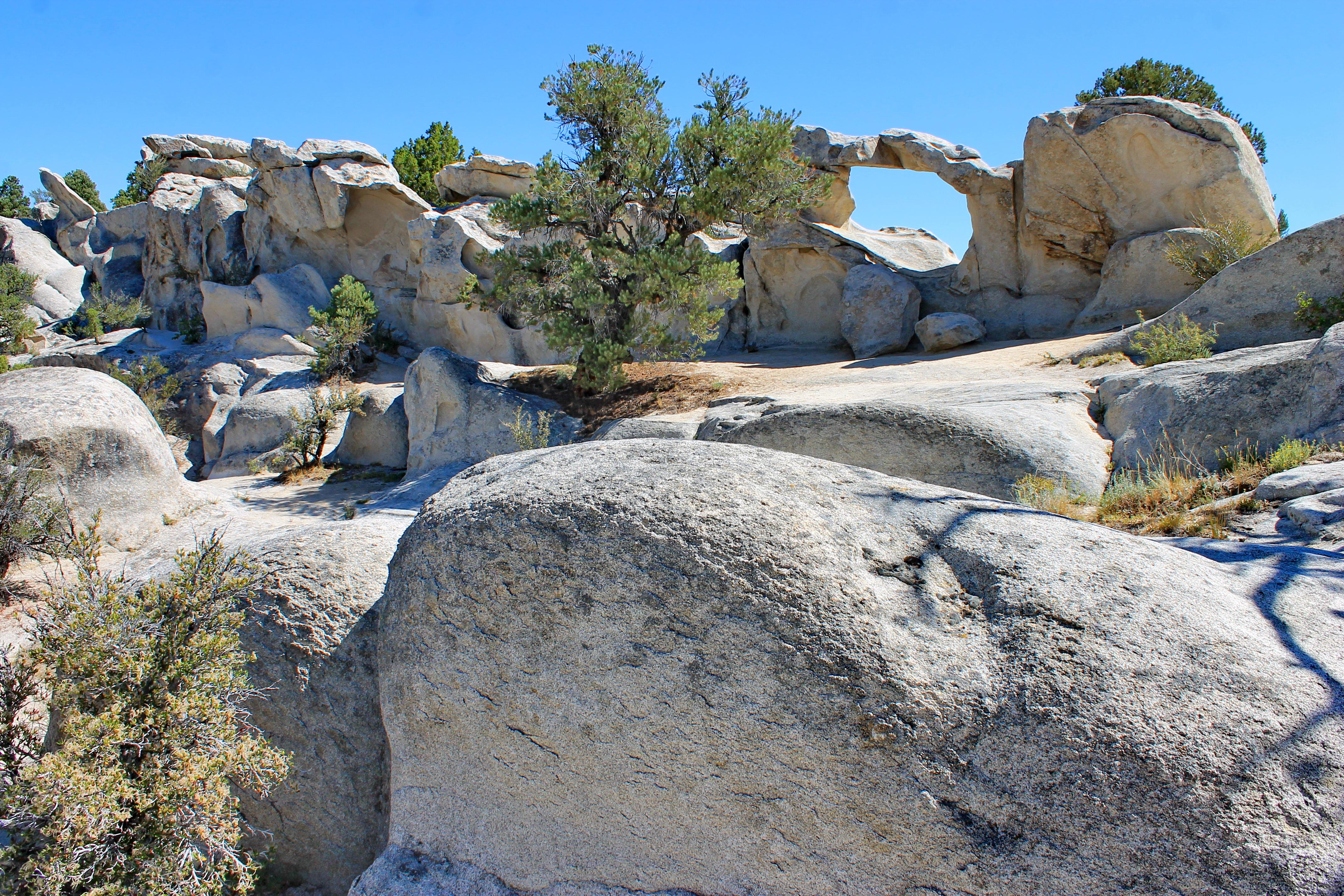 A granite arch is displayed on the horizon