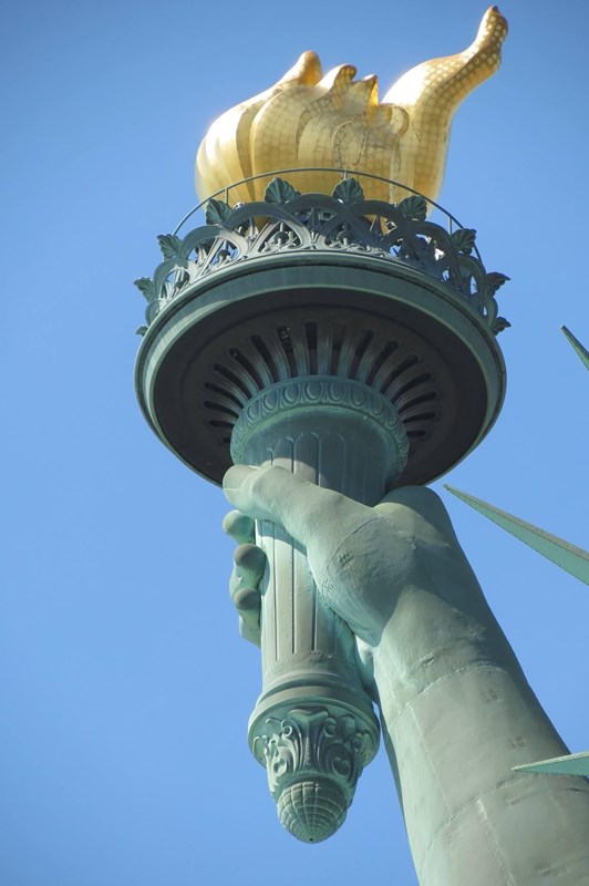 The right hand and torch of the Statue of Liberty.