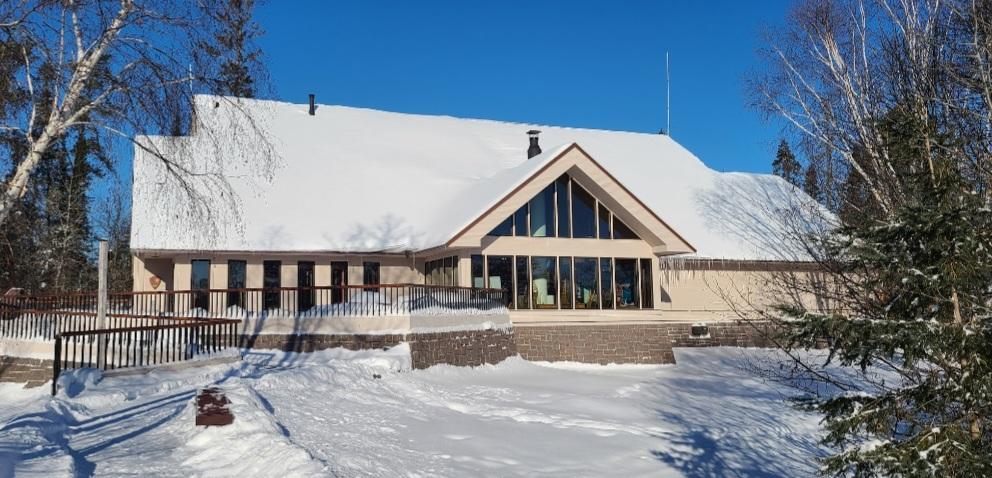 Photograph of a building covered in snow.